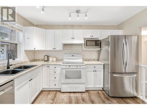 102 3825 Glen Canyon Drive, West Kelowna, BC - Indoor Photo Showing Kitchen With Double Sink