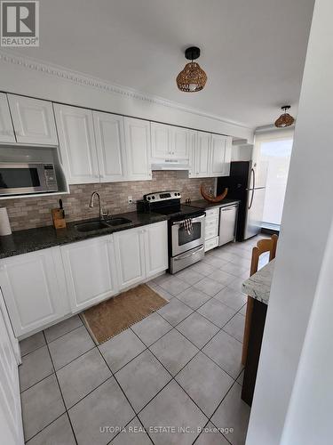 203 - 2170 Bromsgrove Road, Mississauga, ON - Indoor Photo Showing Kitchen With Double Sink