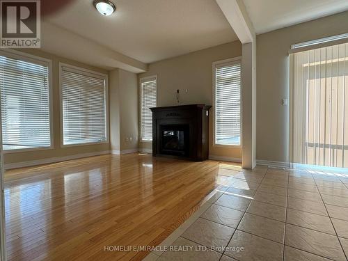 737 Megson Terrace, Milton, ON - Indoor Photo Showing Living Room With Fireplace