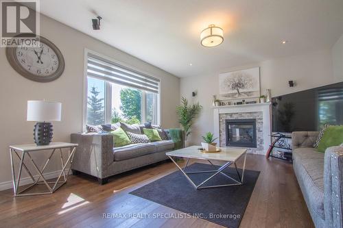 77 Taylor Drive, East Luther Grand Valley, ON - Indoor Photo Showing Living Room With Fireplace