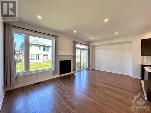 1042 Acoustic Way, Ottawa, ON - Indoor Photo Showing Living Room With Fireplace