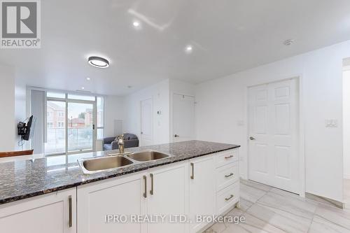 202 - 4600 Steeles Avenue E, Markham, ON - Indoor Photo Showing Kitchen With Double Sink