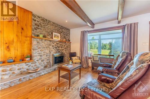 3619 Concession Road 1 Road, Prescott And Russell, ON - Indoor Photo Showing Living Room With Fireplace