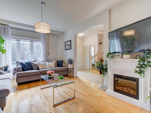 Living room - 7497 Rue Des Perce-Neige, Longueuil (Saint-Hubert), QC - Indoor Photo Showing Living Room With Fireplace