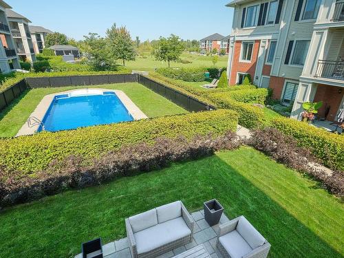 Pool - 2-658 Rue Des Sureaux, Boucherville, QC - Outdoor With In Ground Pool With Backyard