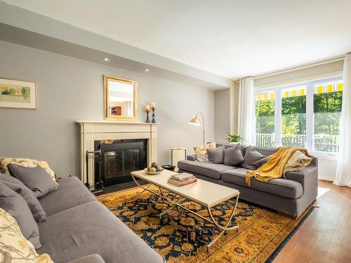 Living room - 349 Rue Woodcroft, Hudson, QC - Indoor Photo Showing Living Room With Fireplace