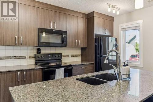 1311 Auburn Bay Circle Se, Calgary, AB - Indoor Photo Showing Kitchen With Double Sink