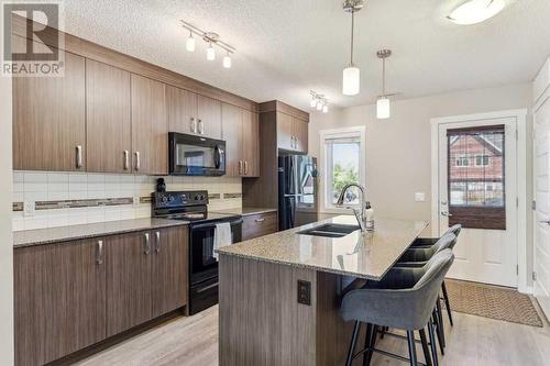 1311 Auburn Bay Circle Se, Calgary, AB - Indoor Photo Showing Kitchen With Double Sink With Upgraded Kitchen