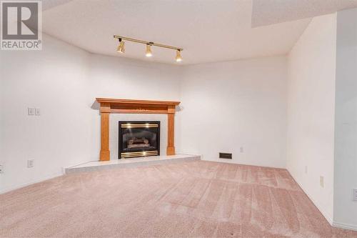 89 Riverview Point Se, Calgary, AB - Indoor With Fireplace