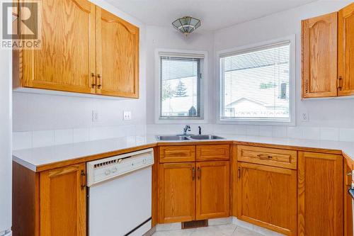 89 Riverview Point Se, Calgary, AB - Indoor Photo Showing Kitchen With Double Sink