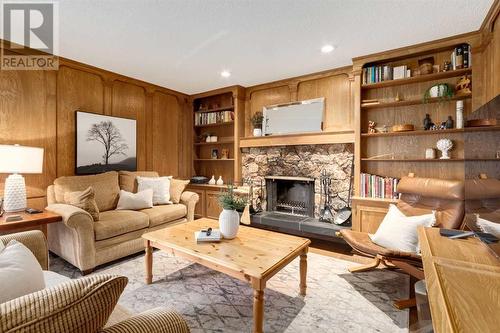 41 Strabane Place Sw, Calgary, AB - Indoor Photo Showing Living Room With Fireplace