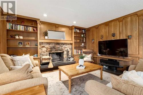 41 Strabane Place Sw, Calgary, AB - Indoor Photo Showing Living Room With Fireplace