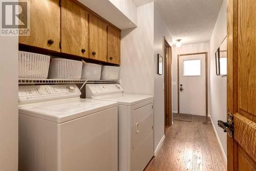 41 Strabane Place Sw, Calgary, AB - Indoor Photo Showing Laundry Room