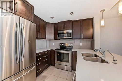 906, 32 Varsity Estates Circle Nw, Calgary, AB - Indoor Photo Showing Kitchen With Stainless Steel Kitchen With Double Sink With Upgraded Kitchen