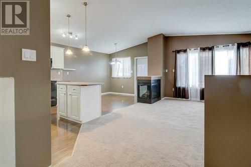 572 Sunridge Crescent W, Lethbridge, AB - Indoor Photo Showing Other Room With Fireplace