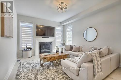 73 Ferragine Crescent, Bradford West Gwillimbury, ON - Indoor Photo Showing Living Room With Fireplace