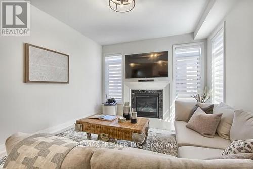 73 Ferragine Crescent, Bradford West Gwillimbury, ON - Indoor Photo Showing Living Room With Fireplace