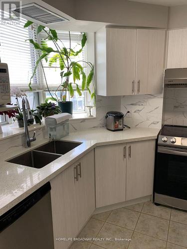 710 - 1883 Mcnicoll Avenue, Toronto (Steeles), ON - Indoor Photo Showing Kitchen With Double Sink