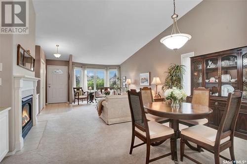 114 801 Heritage Crescent, Saskatoon, SK - Indoor Photo Showing Dining Room With Fireplace