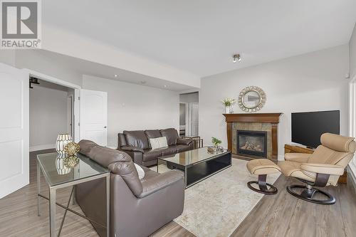 4822 Carmel Crescent, Kelowna, BC - Indoor Photo Showing Living Room With Fireplace