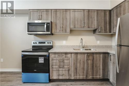 183 Rykert Street Street Unit# B, St. Catharines, ON - Indoor Photo Showing Kitchen With Double Sink