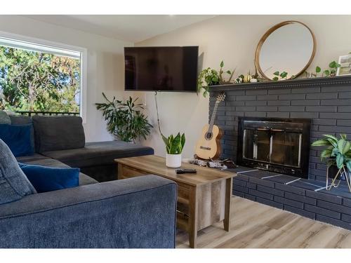 36 Anderson Crescent, Cranbrook, BC - Indoor Photo Showing Living Room With Fireplace