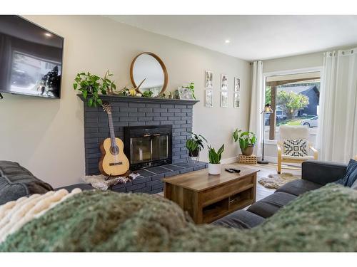 36 Anderson Crescent, Cranbrook, BC - Indoor Photo Showing Living Room With Fireplace