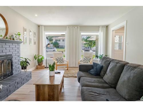 36 Anderson Crescent, Cranbrook, BC - Indoor Photo Showing Living Room With Fireplace