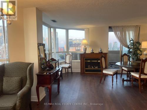 2408 - 400 Webb Drive, Mississauga (City Centre), ON - Indoor Photo Showing Living Room With Fireplace