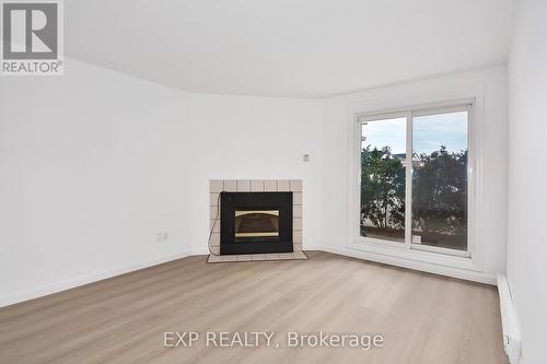 57 - 144 Conway Drive, London, ON - Indoor Photo Showing Living Room With Fireplace