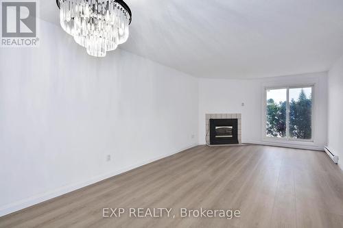 57 - 144 Conway Drive, London, ON - Indoor Photo Showing Living Room With Fireplace