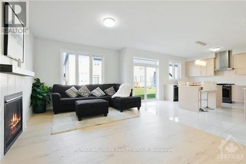 331 Finial Way, Ottawa, ON - Indoor Photo Showing Living Room With Fireplace