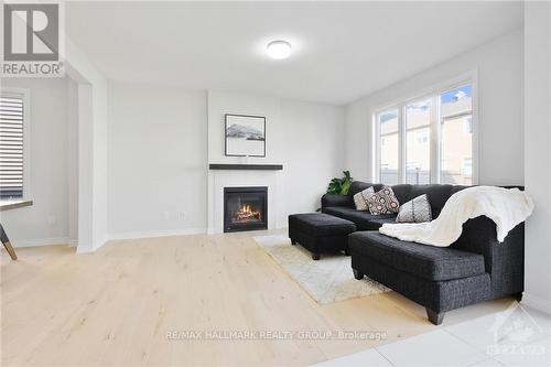 331 Finial Way, Ottawa, ON - Indoor Photo Showing Living Room With Fireplace