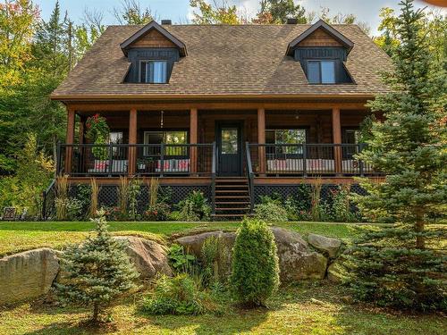 Frontage - 5 Mtée Du Refuge, Sainte-Marguerite-Du-Lac-Masson, QC - Outdoor With Deck Patio Veranda