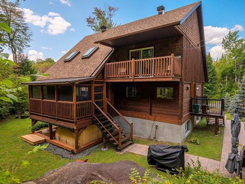 Back facade - 5 Mtée Du Refuge, Sainte-Marguerite-Du-Lac-Masson, QC - Outdoor With Deck Patio Veranda