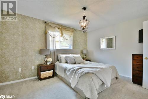 Primary suite with large closet and semi ensuite. - 165 Cheltenham Road, Barrie, ON - Indoor Photo Showing Bedroom