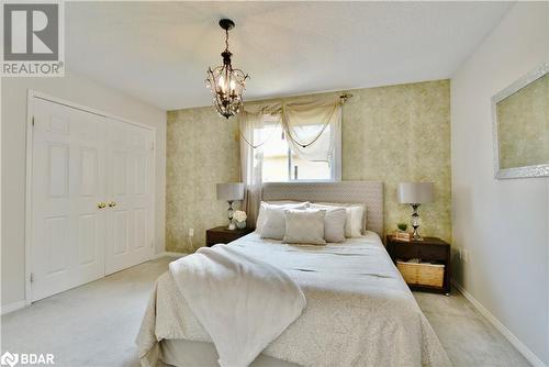 Primary suite with large closet and semi ensuite. - 165 Cheltenham Road, Barrie, ON - Indoor Photo Showing Bedroom