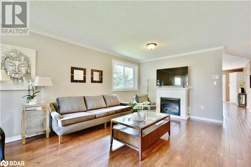 Large living room with gas fireplace! - 165 Cheltenham Road, Barrie, ON - Indoor Photo Showing Living Room With Fireplace