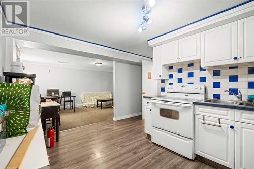 Basement Kitchen - 1468 Renfrew Drive Ne, Calgary, AB - Indoor Photo Showing Kitchen With Double Sink