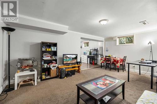 Basement Livingroom - 1468 Renfrew Drive Ne, Calgary, AB - Indoor