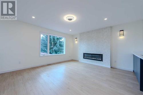 40 Patterson Rise Sw, Calgary, AB - Indoor Photo Showing Living Room With Fireplace