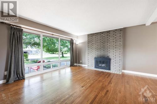 15 Ilkley Crescent, Ottawa, ON - Indoor Photo Showing Living Room With Fireplace