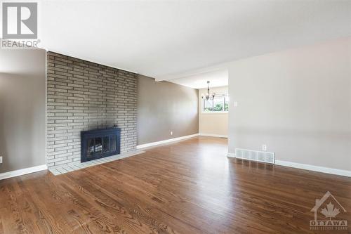 15 Ilkley Crescent, Ottawa, ON - Indoor Photo Showing Living Room With Fireplace