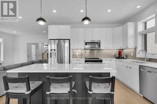 24 Locky Lane, Middlesex Centre (Kilworth), ON - Indoor Photo Showing Kitchen With Stainless Steel Kitchen With Double Sink With Upgraded Kitchen