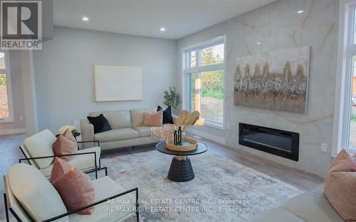 1123 Waterwheel Road E, London, ON - Indoor Photo Showing Living Room With Fireplace