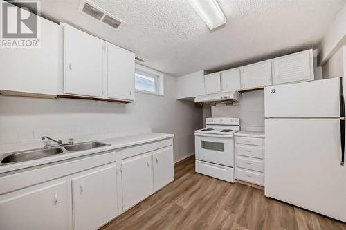 6303 Penbrooke Drive Se, Calgary, AB - Indoor Photo Showing Kitchen With Double Sink