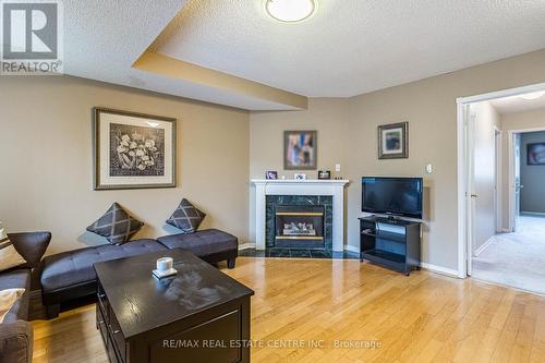 142 - 455 Apache Court, Mississauga (Hurontario), ON - Indoor Photo Showing Living Room With Fireplace