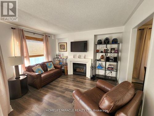 17 Clover Bloom Road, Brampton, ON - Indoor Photo Showing Living Room With Fireplace