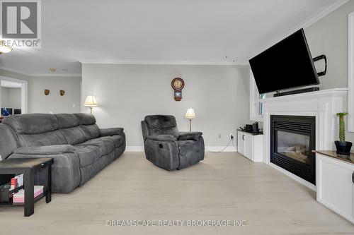 407 Riverview Drive, Strathroy-Caradoc (Ne), ON - Indoor Photo Showing Living Room With Fireplace