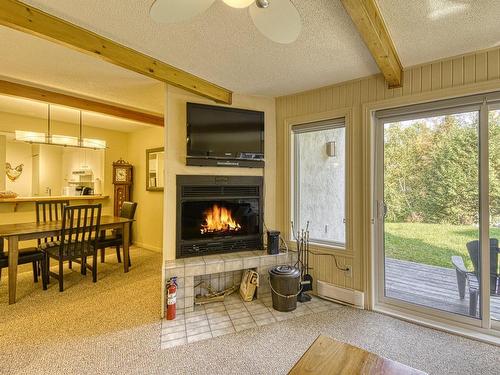 Living room - 310-113 Rue Cuttle, Mont-Tremblant, QC - Indoor With Fireplace